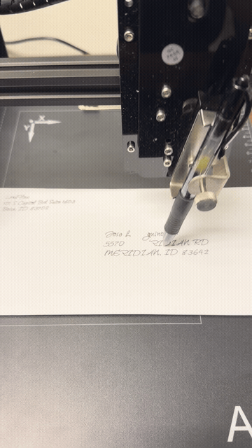 Handwriting tool addressing an envelope with real pen and ink